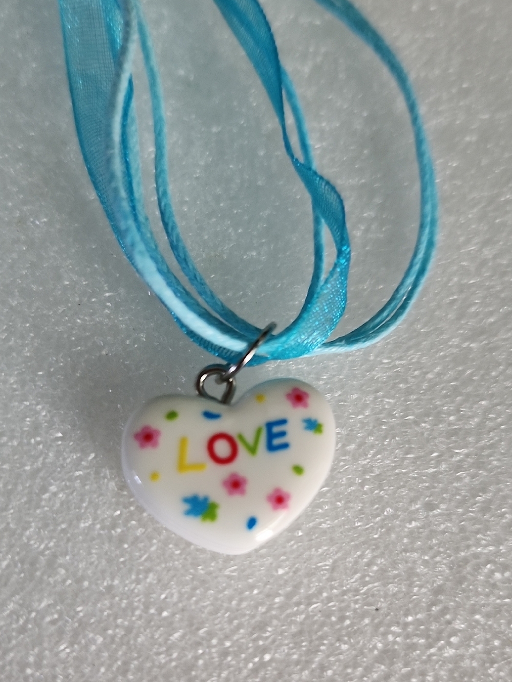 Hand Crafted White Heart Pendant Necklace with Blue Ribbon